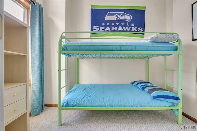 bedroom with light colored carpet