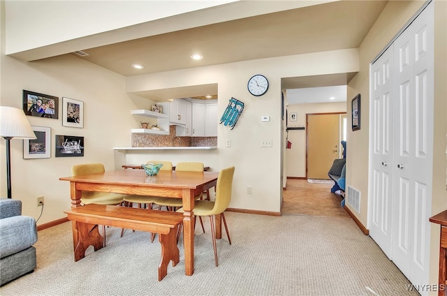 view of carpeted dining area