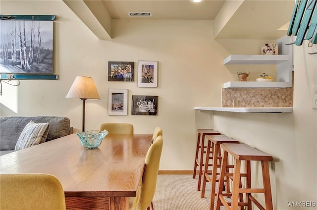 view of carpeted dining area