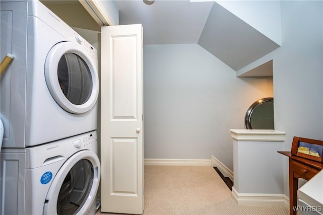 washroom featuring light colored carpet and stacked washer / drying machine