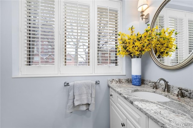 bathroom featuring vanity and a wealth of natural light