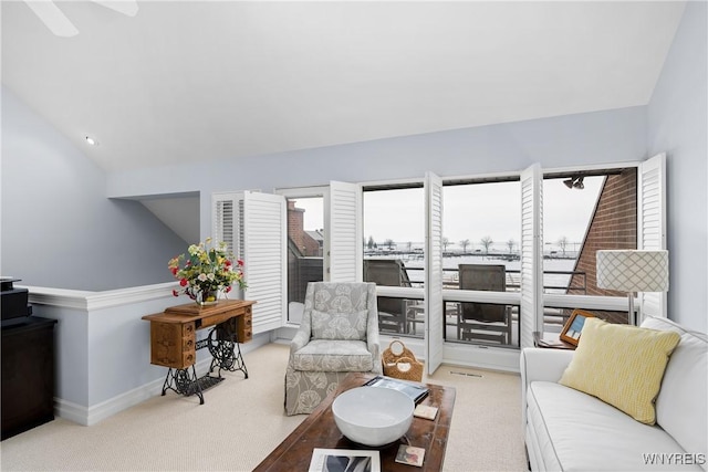 carpeted living room with vaulted ceiling