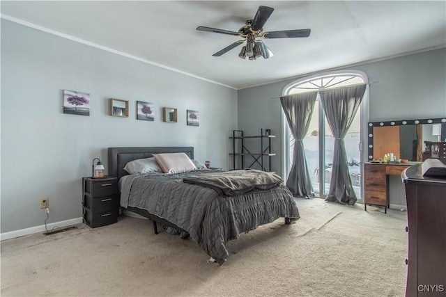 bedroom featuring crown molding, ceiling fan, access to exterior, and light carpet