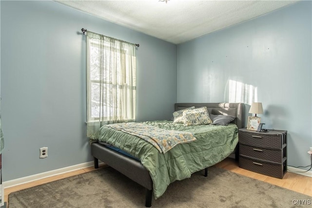 bedroom featuring light wood-type flooring