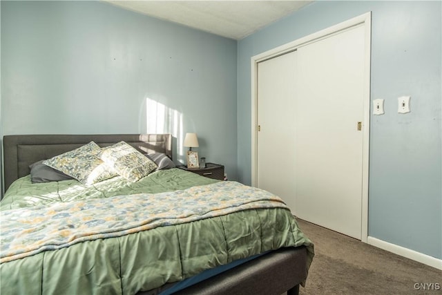 bedroom with carpet floors and a closet