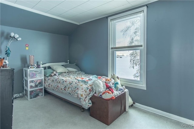 bedroom with lofted ceiling and light carpet