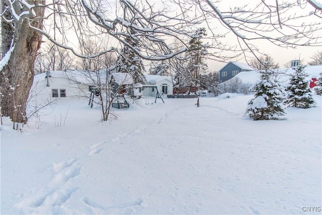 view of yard layered in snow