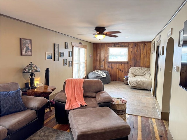 living room with ceiling fan and hardwood / wood-style floors