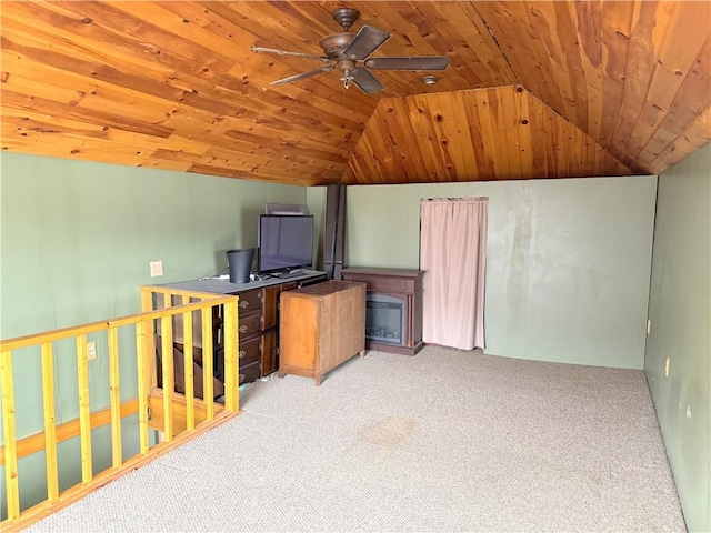 interior space with ceiling fan, lofted ceiling, light carpet, and wooden ceiling