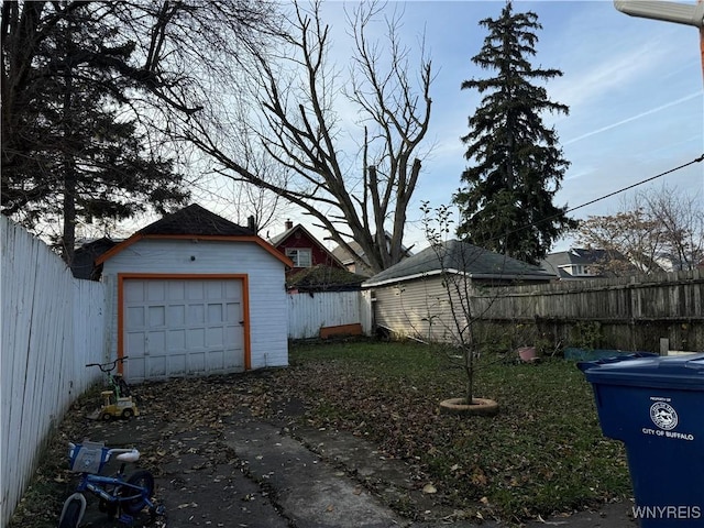 exterior space with a garage and an outdoor structure