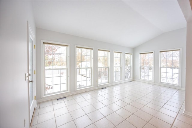 unfurnished sunroom with a healthy amount of sunlight and vaulted ceiling