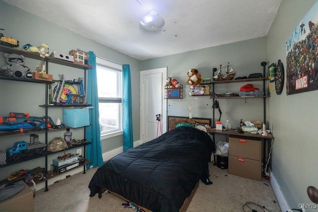 bedroom featuring light carpet