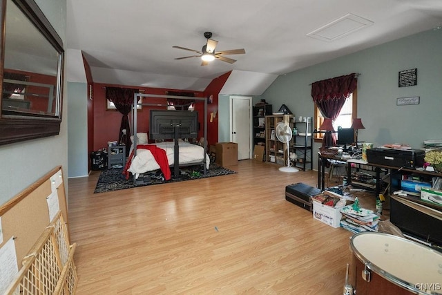 bedroom featuring vaulted ceiling and light wood-type flooring