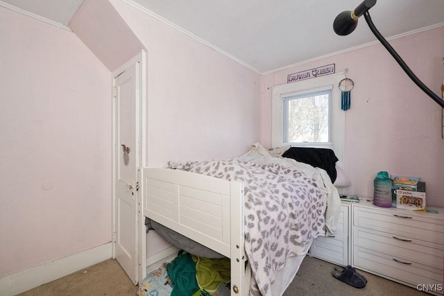 carpeted bedroom featuring crown molding