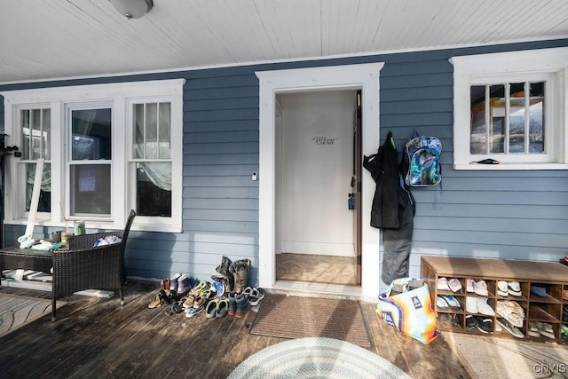 property entrance featuring a wooden deck