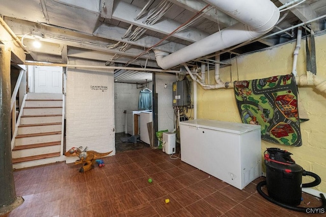 basement with refrigerator and water heater