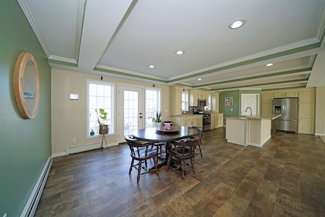 dining space featuring dark wood-type flooring, ornamental molding, a raised ceiling, and baseboard heating