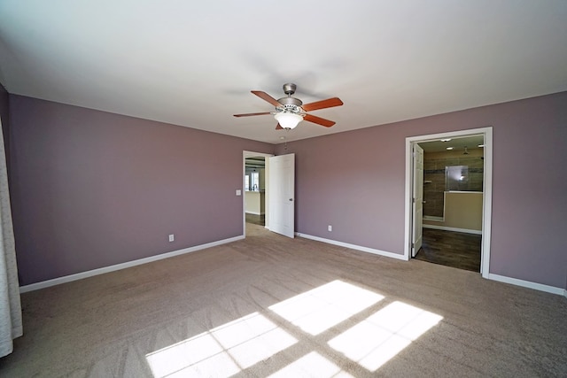 unfurnished bedroom with ceiling fan, connected bathroom, and light carpet