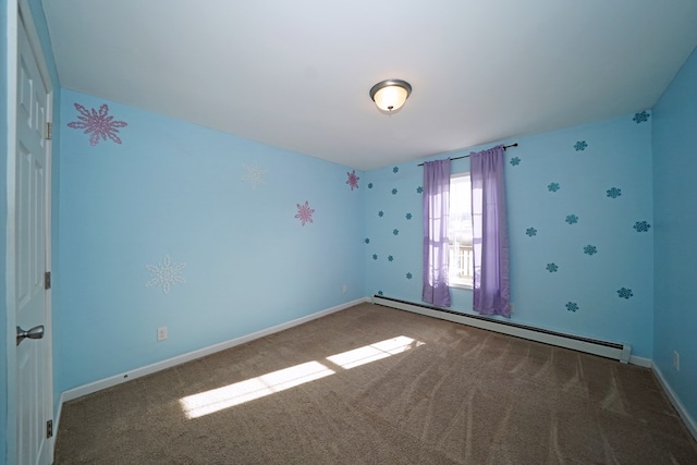 carpeted spare room featuring baseboard heating