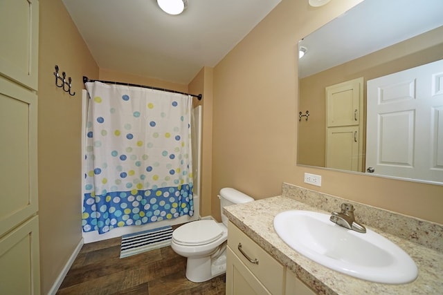 full bathroom with toilet, vanity, shower / bathtub combination with curtain, and hardwood / wood-style floors