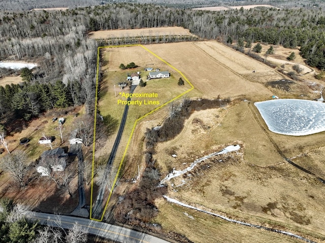 birds eye view of property featuring a rural view