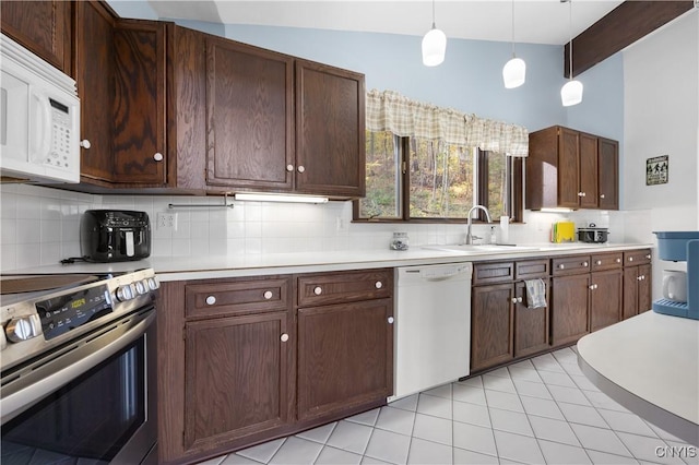 kitchen featuring decorative light fixtures, tasteful backsplash, sink, light tile patterned floors, and white appliances