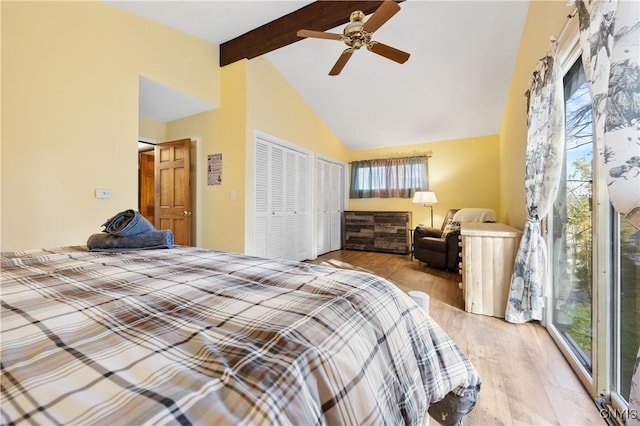 bedroom with multiple windows, a closet, beam ceiling, and light hardwood / wood-style floors