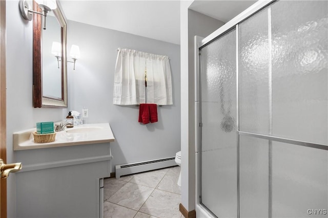 bathroom featuring vanity, a baseboard radiator, a shower with shower door, and toilet