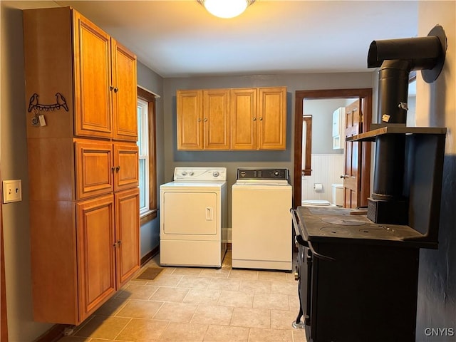 laundry area with cabinets and washer and clothes dryer