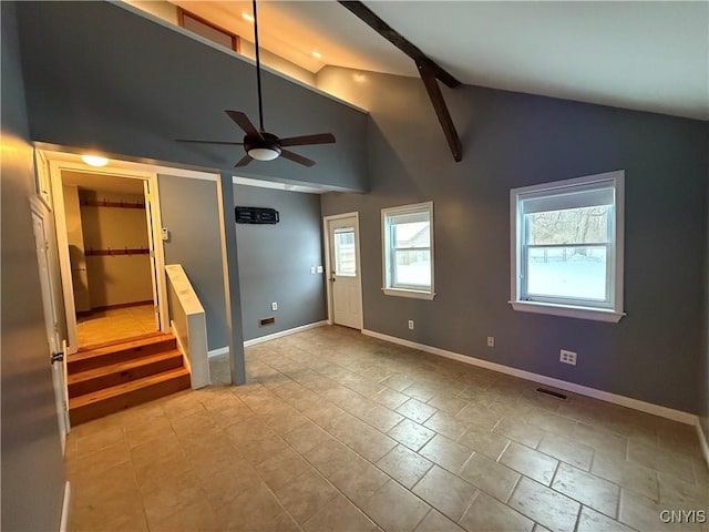 interior space featuring high vaulted ceiling and beamed ceiling