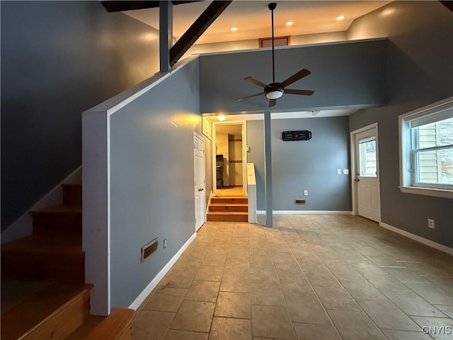 555 County Route 51, New Haven, NY 13114 - unfurnished living room with stairway, ceiling fan, baseboards, recessed lighting, and a high ceiling