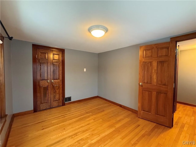 unfurnished bedroom with light hardwood / wood-style flooring