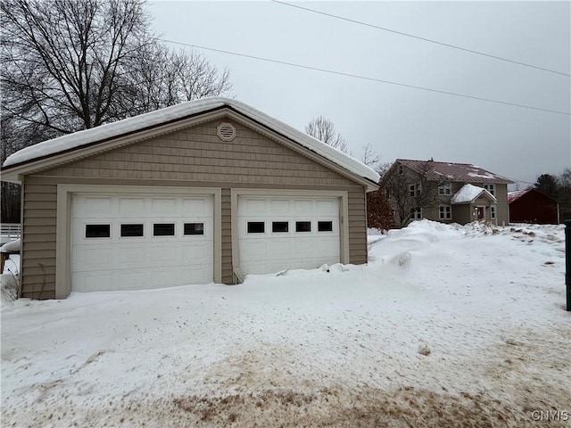 view of snow covered garage