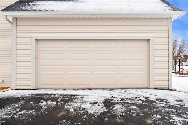 view of snow covered garage