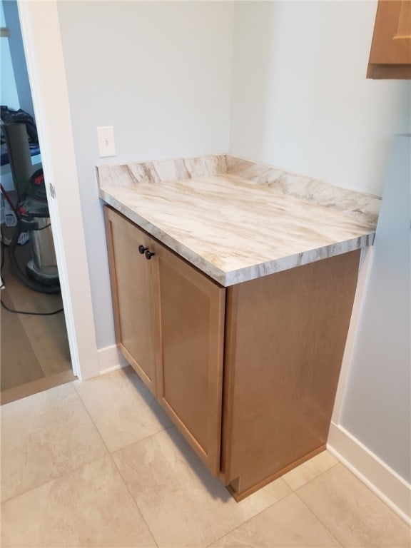 bathroom with tile patterned floors