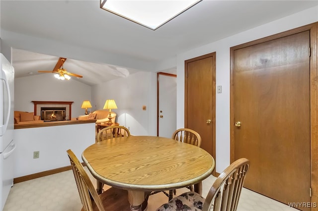 dining room featuring ceiling fan and vaulted ceiling