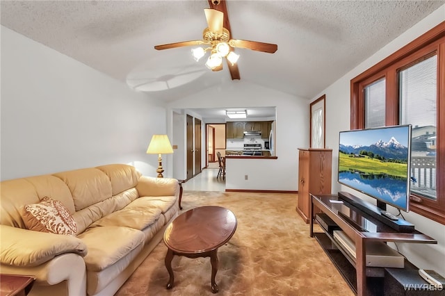 living room featuring ceiling fan, vaulted ceiling, light carpet, and a textured ceiling