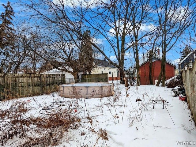 view of yard layered in snow