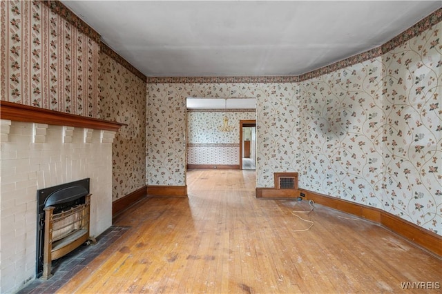 unfurnished living room with hardwood / wood-style floors