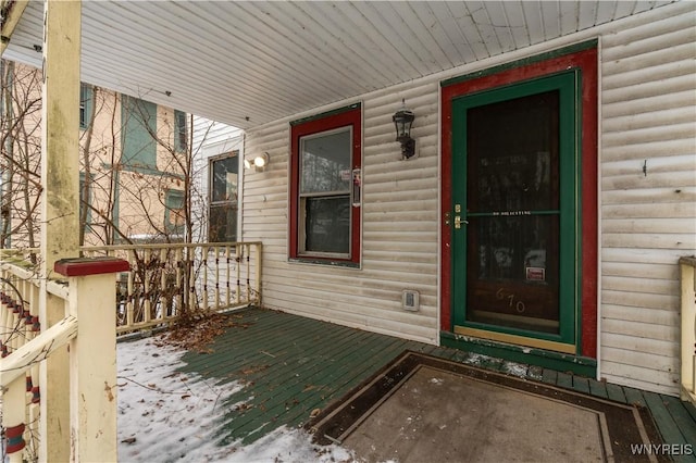 doorway to property featuring a porch