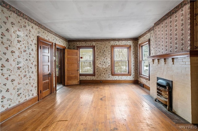 unfurnished living room with hardwood / wood-style floors