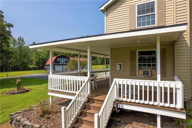 doorway to property with a lawn and a porch