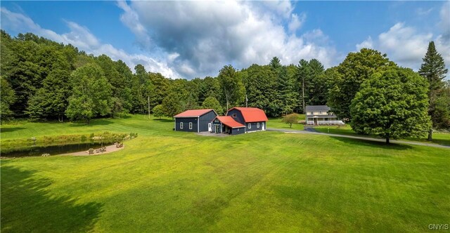 exterior space featuring a water view and a yard