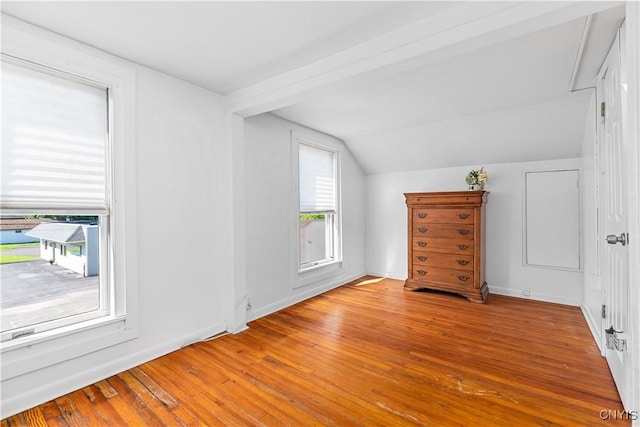 bonus room featuring hardwood / wood-style flooring and lofted ceiling