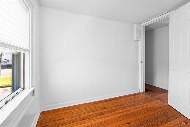 unfurnished room featuring hardwood / wood-style floors