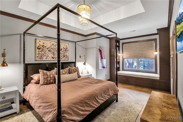 bedroom featuring light parquet flooring, a chandelier, and crown molding