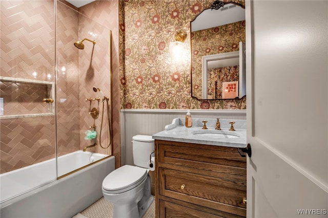 full bathroom with vanity, toilet, and combined bath / shower with glass door