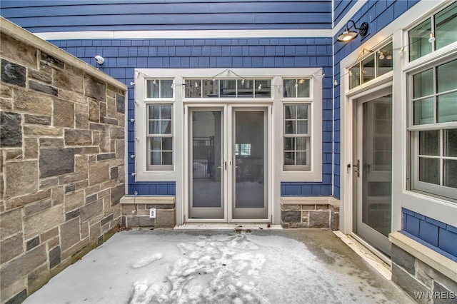 doorway to property featuring a patio area