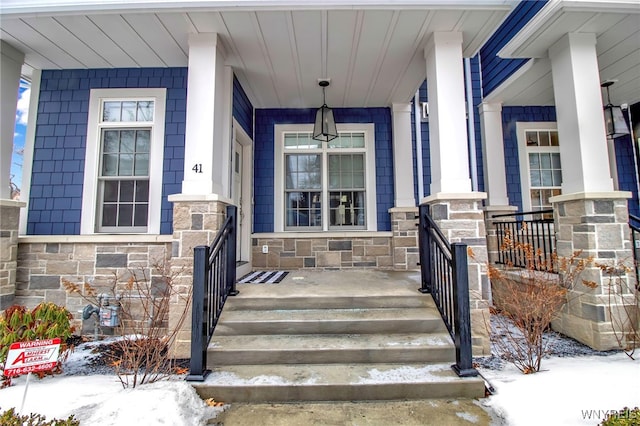 view of snow covered property entrance