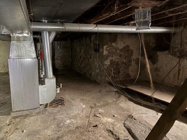 basement featuring heating unit